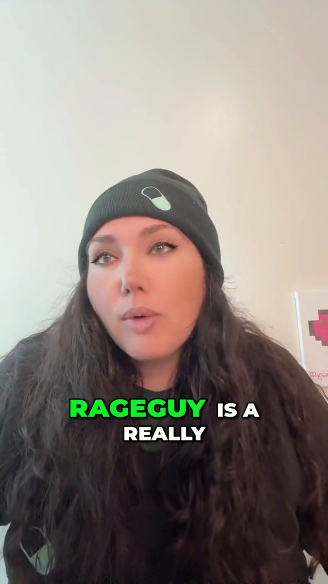 The image features a woman with long brown hair wearing a black beanie, standing against a white wall. The caption of the image reads "RAGEGUY isn't just a memecoin It's a MOVEMENT. JOIN THE CULT - SPREAD THE RAGE". This message is related to the post because it encourages people to join the Rage Guy movement and spread awareness about the issues they are fighting for.