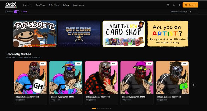 A screenshot of the OrdX marketplace homepage featuring a dark theme, displaying banners for 'PUPSOCIETY', 'BITCOIN CYBORGS', a card shop promotion, and a row of 'Recently Minted' Bitcoin Cyborgs 10K NFT cards.
