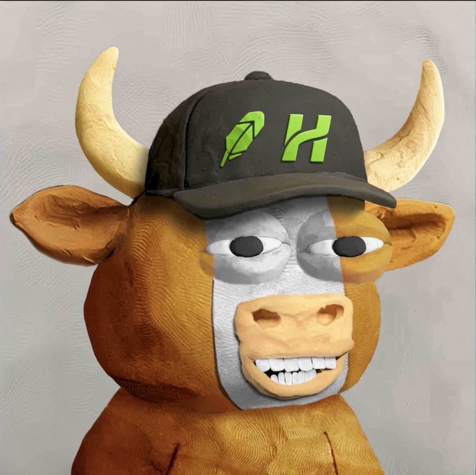 A claymation-style figure of a brown bull with horns wearing a black cap with green 'PH' logo letters.