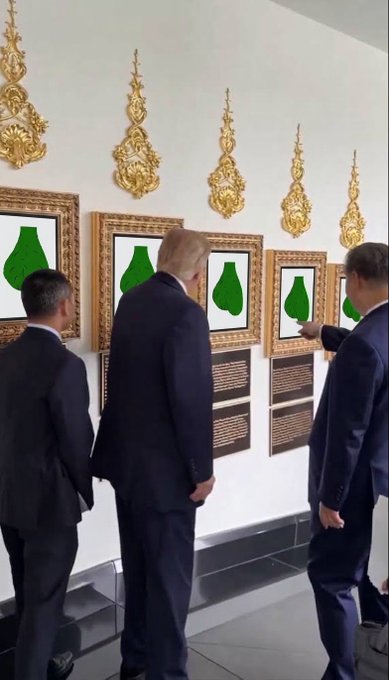 Three men in suits viewing framed pear-shaped artworks displayed on a wall with ornate golden Thai-style decorations.