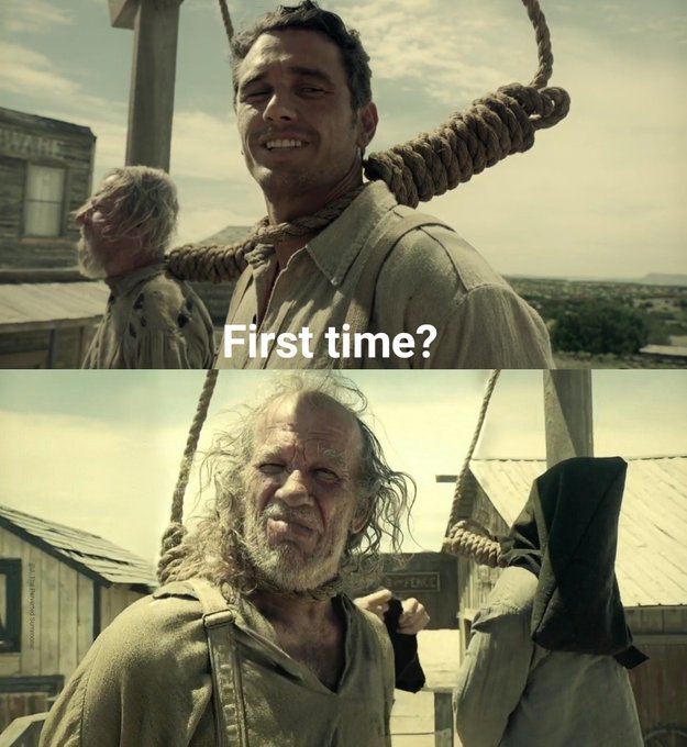 The image shows two men with long hair wearing old-fashioned clothing, possibly from the early 1900s era. One man has his neck tied up by a rope while the other man looks at him. The caption of the image reads "First time? No". This could be interpreted as a humorous or satirical statement about Bitcoin and its current state in the market.