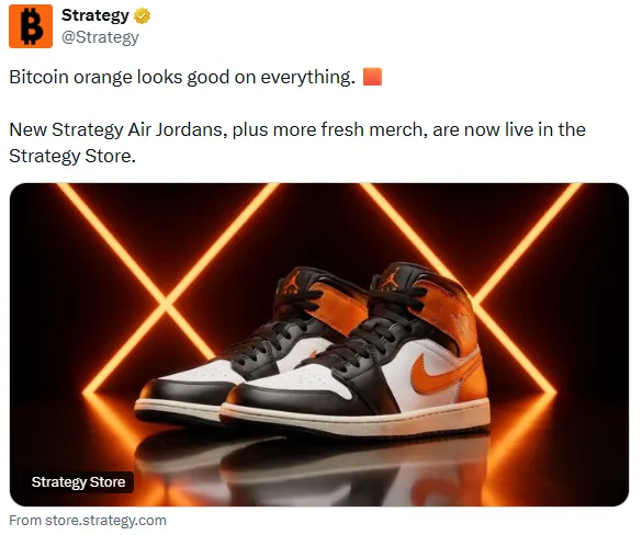 A Strategy social-media post reads “Bitcoin orange looks good on everything” and advertises new Strategy Air Jordans at the Strategy Store, featuring black, white, and orange sneakers.