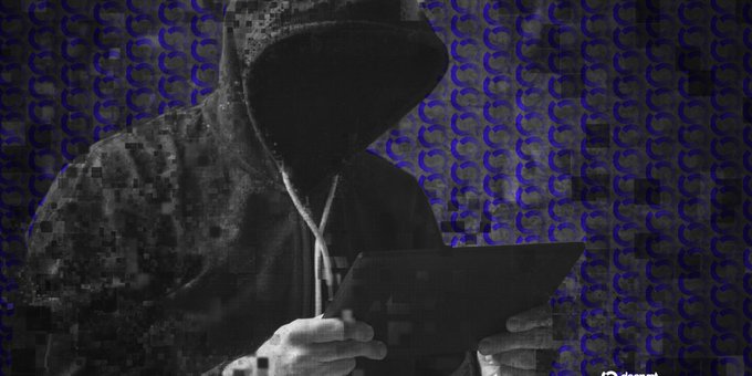 A dark, pixelated graphic of a hooded figure looking down at a tablet or document, set against a repeating background pattern of dark grey and blue.