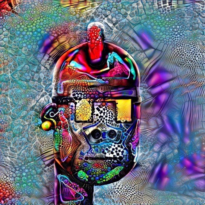 A vibrant, psychedelic digital artwork featuring a stylized skull or mask with colorful, intricate patterns including a red figure on top, set against a swirling, textured background of blues, purples, and greens.