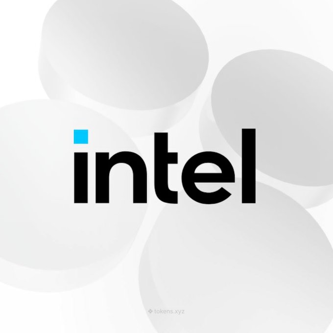 Intel logo displayed in black text with a small blue square over the 'i', with 'tokens.xyz' watermark at the bottom.