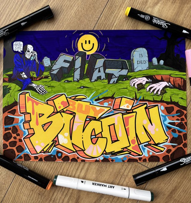 A colorful graffiti-style artwork titled 'I BUY IT AGAIN' featuring a skeleton in a suit, a smiley face, and a tombstone reading 'IS DED', displayed on a wooden surface surrounded by Sharpie and art markers.