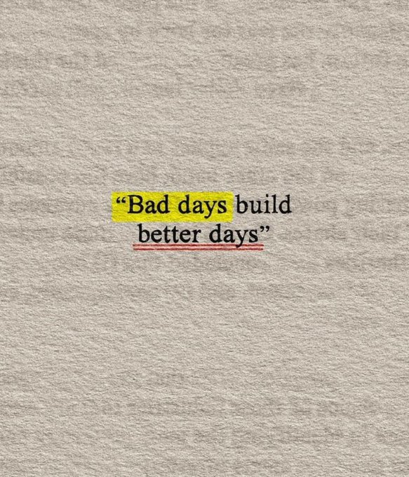 A motivational quote graphic on a textured gray background reading 'Bad days build better days,' with 'Bad days' highlighted in yellow and 'better days' underlined in red.