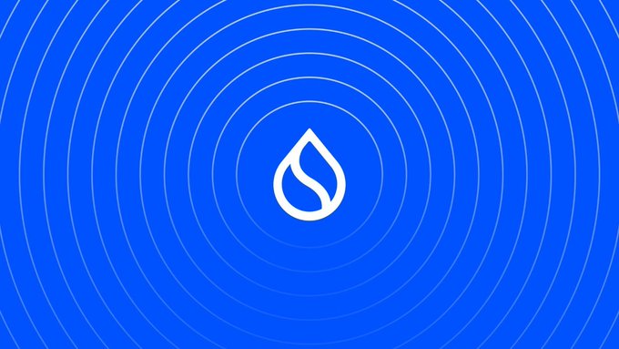 A blue graphic design featuring a white stylized leaf/droplet logo in the center surrounded by concentric white circles, resembling the Sui blockchain branding.