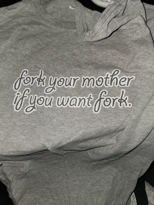 A gray t-shirt featuring the humorous text 'fork your mother if you want fork.' printed in white cursive lettering.
