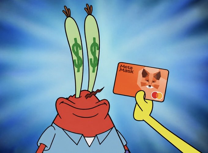 A SpongeBob SquarePants meme showing Mr. Krabs with green dollar signs in his eyes excitedly holding up a 'MetaMask' crypto card featuring a fox logo.