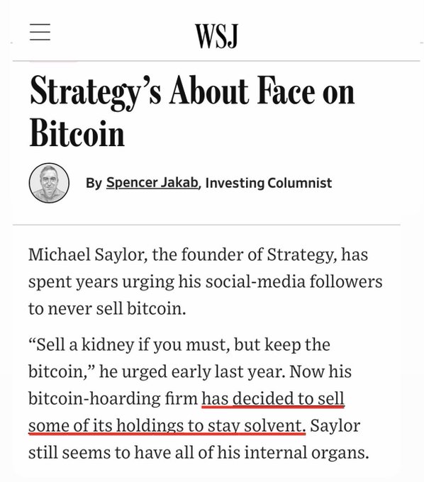 The image shows a screenshot from an article by The Wall Street Journal titled "Strategy's About Face On Bitcoin." The main focus of this piece seems to be on the founder of Strategy, Michael Saylor, who has decided to sell some of his holdings to stay solvent. It is an eye-catching headline and an unusual claim about the value of bitcoin that can draw attention to the article or blog post.