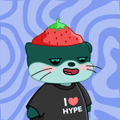 A small cartoon sticker of a white cat-like character wearing a green hoodie, a strawberry on its head, and a shirt that says 'HYPE', set against a swirly purple background.
