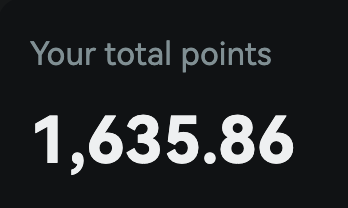 A dark screen displaying the text 'Your total points' above the number '1,635.86' in large white text.