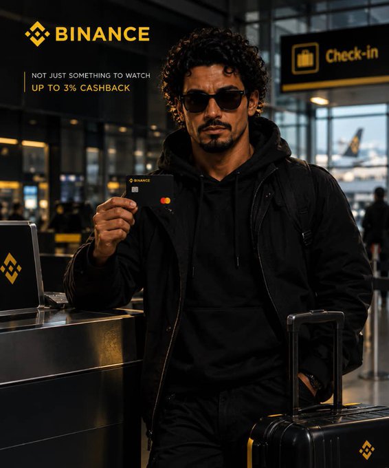 A promotional advertisement featuring a man in a black jacket and sunglasses holding a Binance card at an airport check-in counter, with text reading 'BINANCE', 'NOT JUST SOMETHING TO WATCH', and 'UP TO 3% CASHBACK'.