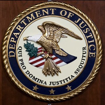 The Department of Justice seal, featuring its iconic bald eagle and Latin motto "QUI PRO DOMINA JUSTITIA SEQUITUR," is shown, connecting to news that the DOJ is dropping charges against Matthew Goettsche, the alleged mastermind of a $722 million BitClub crypto mining Ponzi scheme.