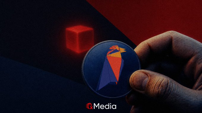 A dark image showing a hand holding a coin with a red and blue fox-like logo, with a red glowing cube in the background and text 'IQMedia' at the bottom.