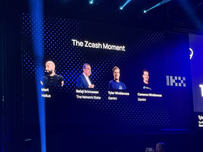 A conference screen titled 'The Zcash Moment' showing panelists Mert Helius, Balaji Srinivasan (The Network State), Tyler Winklevoss, and Cameron Winklevoss (Gemini).