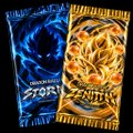 Two Pokémon trading card game booster packs displayed together - a blue Psychic-type themed pack and an orange fiery-themed pack.