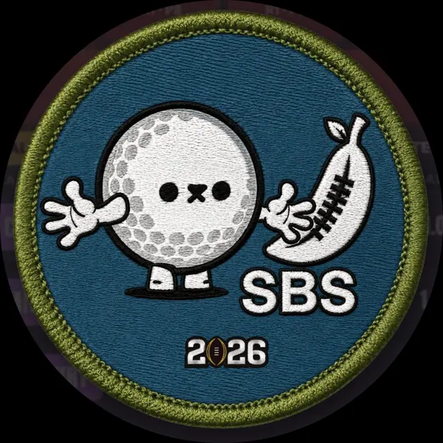 An embroidered patch with a green border features a cartoon golf ball character, a stylized banana shoe, the text ‘SBS’ and a football-shaped ‘2026’ on a teal background.