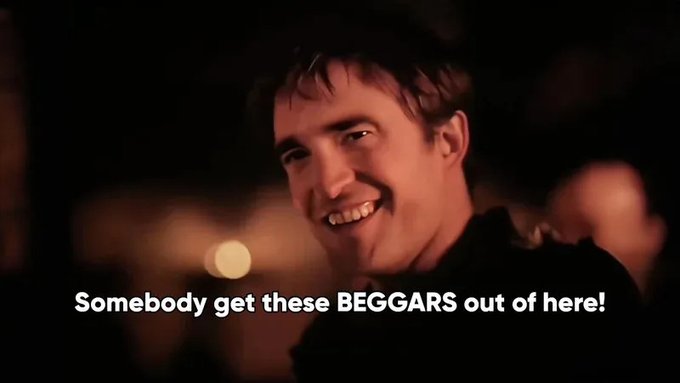Movie scene of a smiling man with the caption 'Somebody get these BEGGARS out of here!'