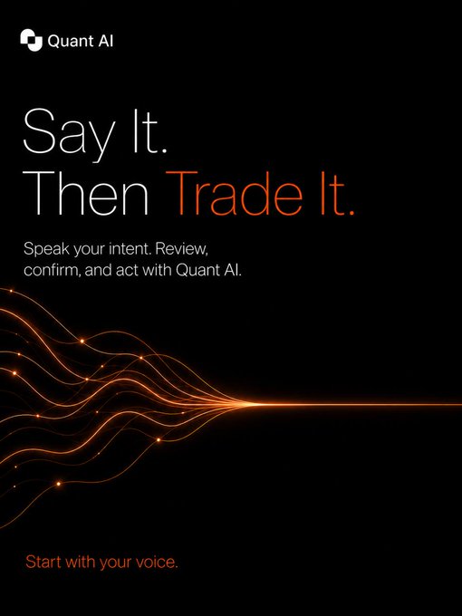 The image features a poster for Quant AI, which promotes the idea of using voice commands to execute trading tasks. The poster has an orange background with white text that reads "Say It Then Trade It." Below this, there are two lines of orange and white text that say "Start with your voice. Less clicking. Less friction. More action." This suggests that Quant AI is encouraging users to use their voices for trading purposes rather than relying on traditional mouse clicks or keyboard inputs.