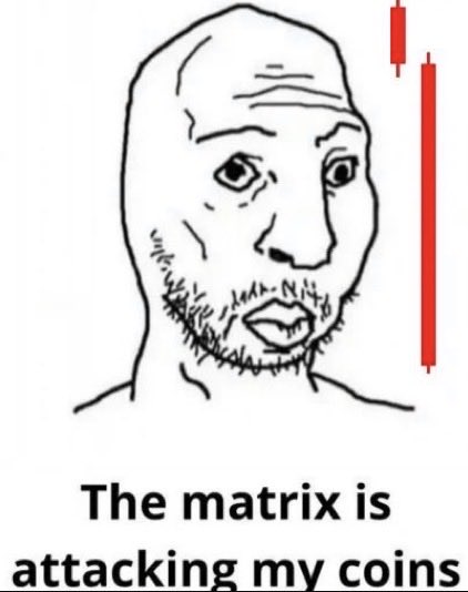 A classic "Wojak" meme depicts a distressed, bearded man with a worried expression, accompanied by a large red downward candlestick on the right, symbolizing a market crash. The caption reads "The matrix is attacking my coins," humorously framing a crypto price drop as a coordinated attack by a sinister system on the trader's portfolio.