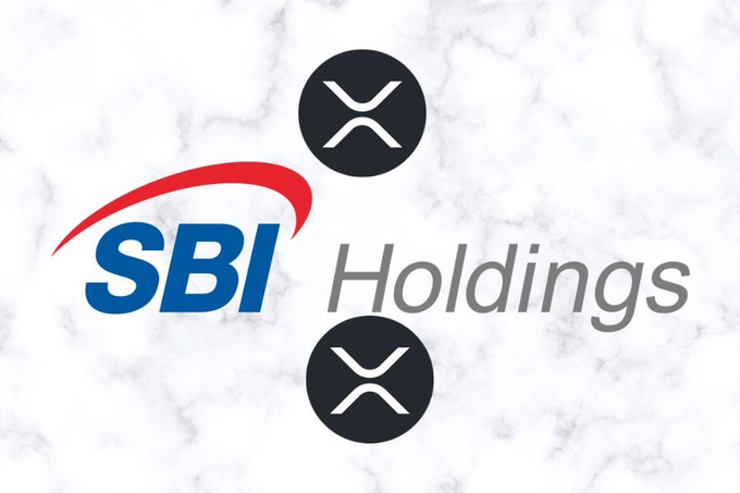 The image displays the SBI Holdings logo alongside two XRP cryptocurrency icons set against a white marble background, visually connecting SBI's financial holdings with the Ripple/XRP ecosystem referenced in the post about Japan adopting XRP and a new decentralized network announcement.