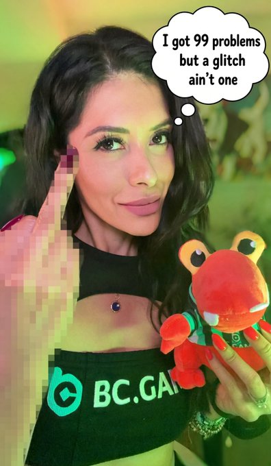 A woman wearing a "BC.GAME" branded top holds a red frog plushie, with a thought bubble reading "I got 99 problems but a glitch ain't one," playfully addressing FUD surrounding the $BC platform she just covered in her unstaking video.