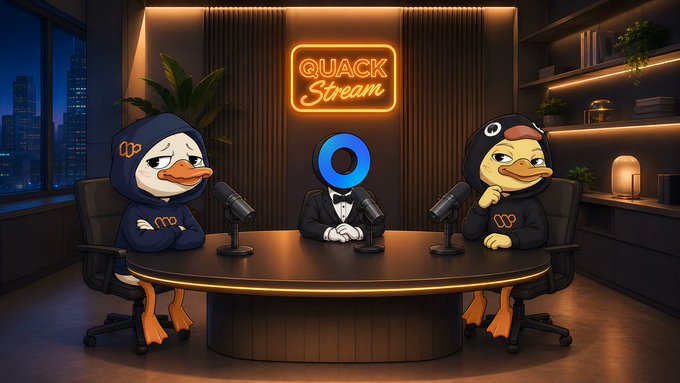 The image features a cartoon scene of three cartoon ducks sitting around a table, appearing to be having a conversation or participating in an interview. The ducks are dressed in costumes that resemble suits, adding a unique touch to their appearance. The background includes a neon sign with the text "Quack Stream" and a city skyline visible through a window, creating a visually appealing setting for this cartoon scene.