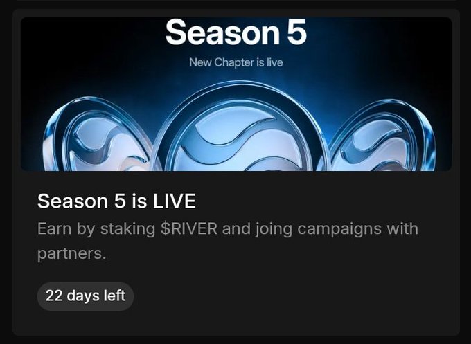 The image shows a poster for an upcoming season of a TV show called "@RIVER". The poster features three blue circles with white swirls inside, which are the main elements of the poster design. The text on the poster announces that the new chapter is live and encourages people to pay $RIVER to join campaigns supporting the cause. The poster also includes a message about the energy still being alive in the @RiverdotInc community, emphasizing the ongoing support for the show's new season.