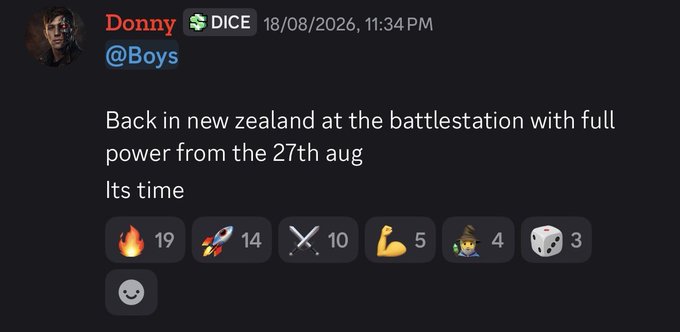 A Discord post by user "Donny" (@Boys) with a DICE role, dated 18/08/2026 at 11:34 PM, announces: "Back in new zealand at the battlestation with full power from the 27th aug. Its time." The message includes reaction counts of 🔥19, 🚀14, ⚔️10, 💪5, 🧙4, 🎲3. The post aligns with the accompanying bullish crypto sentiment, signaling Donny's relocation back to New Zealand ahead of an anticipated major market move.