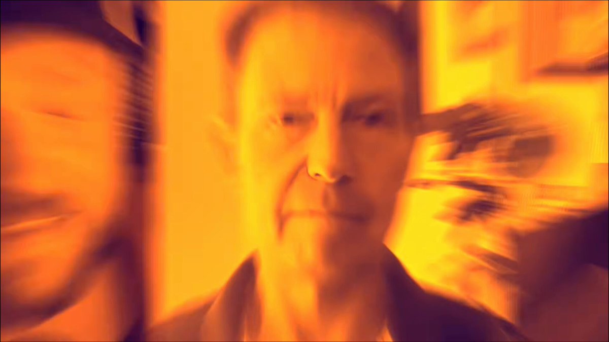 The image features a man with a serious expression, possibly posing for a photo or video. The background appears blurry, which adds an artistic touch to the scene. The caption below the image reads "AI mania, fiat collapse, and governments restricting freedom of movement." This message seems to be related to the current state of affairs in the world, where artificial intelligence (AI) is being used for surveillance purposes or even as a threat against human rights. The post also mentions Bitcoin, which could potentially be linked to the AI-related issues discussed.