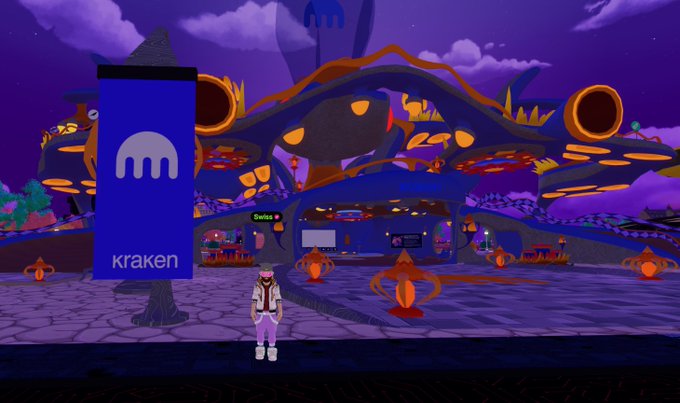 A virtual world scene with a purple sky showing a character standing in front of a Kraken banner and a large alien-like structure, appearing to be a Kraken virtual event or metaverse space.