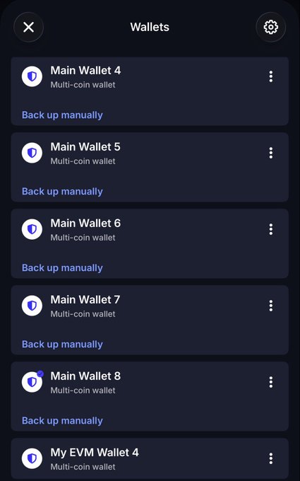 A mobile wallet app screen titled 'Wallets' displaying a list of multi-coin wallets including 'Main Wallet 4', 'Main Wallet 5', 'Main Wallet 6', 'Main Wallet 7', 'Main Wallet 8', and 'My EVM Wallet 4', each with a 'Back up manually' option.