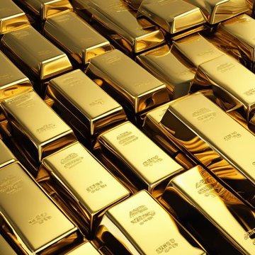 Stacks of gleaming gold bars are arranged in neat rows, with engravings reading "999.9 FINE GOLD" and "NET WT 1000G," symbolizing the precious metals mentioned in the post. The image visually reinforces the context of a rough trading day, where gold and silver suffered significant losses amid broader market declines.