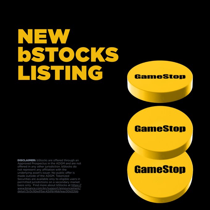 A Binance promotional graphic for GameStop (GME) tokenized stocks, displaying "NEW bSTOCKS LISTING" alongside three stacked yellow tokens labeled "GameStop." The image relates to the post by advertising Binance's tokenized stock offering, with the user questioning how this new listing differs from a direct transfer of the token contract address (CA) for the asset.