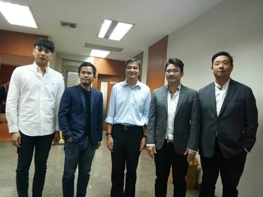 A group of five men pose together in what appears to be a professional or office setting. The image likely relates to the FIRO blockchain and its founder Poramin Insom, showing him alongside associates or colleagues, connecting to the post's reference to Thailand's 2018 blockchain-based e-voting experiment and the privacy-focused FIRO technology.