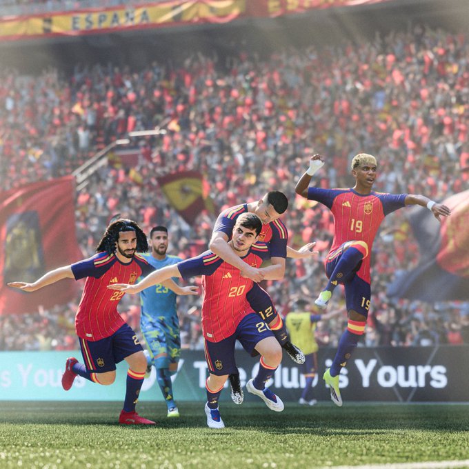 A Spanish national football team celebrates on the field, with "ESPAÑA" visible in the stands, mirroring EA's prediction of them winning the World Cup. This image relates to the post by visually representing Spain as the predicted winner.