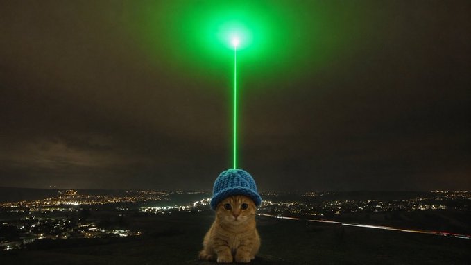 A cat wearing a blue beanie shoots a green laser beam upward from its head, set against a nighttime cityscape.

The image visually reinforces the post's bullish $CATWIF sentiment by depicting the cat as a powerful "laser-eyed" figure ready to blast the token to a new all-time high, symbolizing strong community momentum and imminent price breakout.