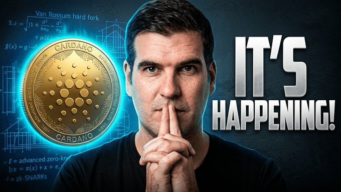 The image features a man with his hands together, making a "shhh" sign as if he's about to give a secret code or reveal something important. The background of the image is dark blue, which contrasts with the gold coin that sits in front of him. Below the coin and the man, there are some text elements written in white, including the words "Cardano", "It's happening!", and "Adventures". These elements suggest that the image might be related to a post about Cardano cryptocurrency or an event involving the use of Cardano coins.