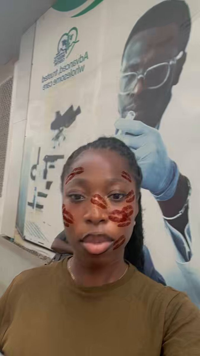 The image features a woman wearing brown t-shirt and red lipstick on her face, standing next to a poster of a man with glasses and a stethoscope around his neck. The poster has a message about studying God's word and the importance of education.