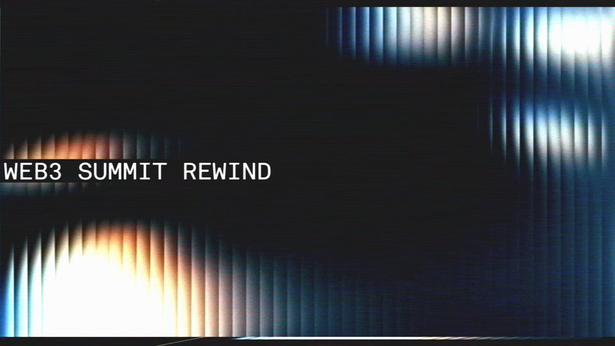 The image features a large screen with a black background and white text. The text reads "WEB3 SUMMIT REWIND", which appears to be an advertisement or promotional material for Web3 Summit. The image also includes a blurred photo of a building, possibly representing a landmark or venue related to the Web3 Summit event.