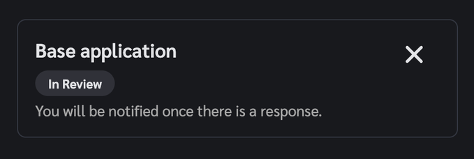 The image shows an email message with a black background, white text, and a red X at the bottom of the screen. The message appears to be from a company or organization, possibly providing instructions or feedback related to a Base Application. The content of the message is not clear enough to determine its exact purpose, but it seems to be relevant to the user's experience with the application.