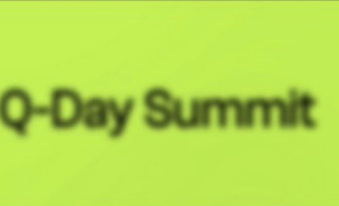 The image features a green background with the text "Q-Day Summit" written in black letters, which appears blurry due to the low quality of the photo. The focus of the image seems to be on the Q-day summit, as there is no other visible content or information about an event happening elsewhere.
