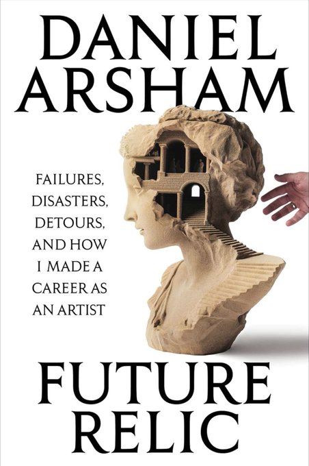 The image features an advertisement for Daniel Arsham's book Future Relic, which is about a man who has had his head carved into a bust of a woman. The cover art shows a close-up of the carved head with the title "Future Relic" displayed in large letters above it and the author's name "Daniel Arsham" written below it. The image also includes a quote from the book, which reads: "Failing. Disasters. Detours. And how I made a career as an artist".