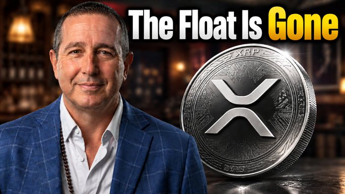 A man in a blue plaid jacket stands next to a large XRP cryptocurrency coin with the headline 'The Float Is Gone' displayed above.