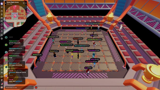 A screenshot from a video game showing multiple player avatars gathered in 'Game Night Arena' with a chat interface on the left side.