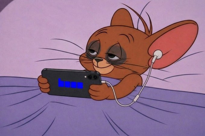 The image features a cartoon character, likely a cat or a mouse, lying down on a bed with its head resting on a pillow while holding a cell phone. The text "Focus on what is in the image" suggests that viewers should pay attention to the details of the scene and not just focus on the main subject matter. The post reads: "Average Base traders at midnight." This phrase might be related to trading or stock market activities, but it does not directly connect with the cartoon character's presence in the image.