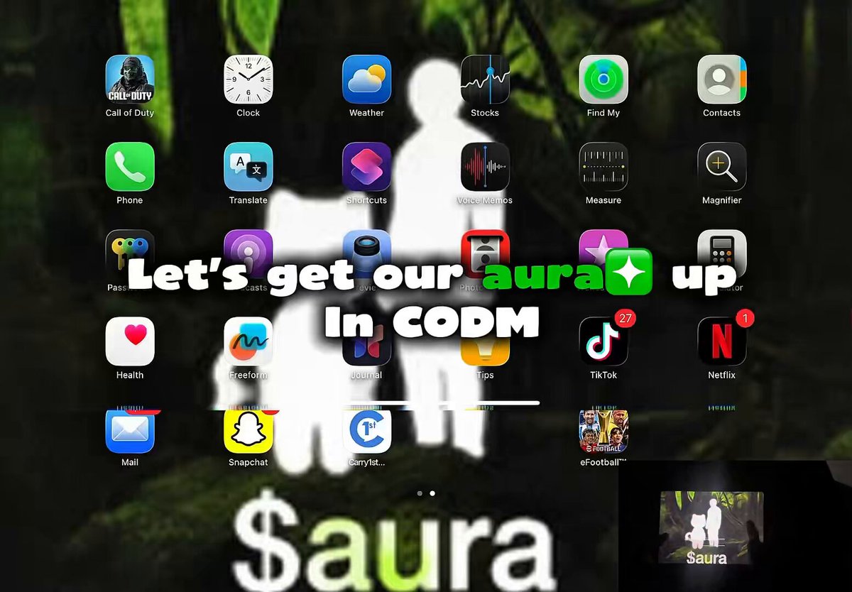 The image features a poster for a video game called "Sura" with various app icons displayed, including social media apps like Facebook, Instagram, Twitter, and Snapchat. The text on the poster reads "Let's get our aura up in CODM", which is likely a reference to the popular mobile gaming app "CODM". The poster also includes an image of a person holding a phone with a caption that says "The Best way to gain $aura is gaming Finally decided to play CODM IRL and show y’all what true $aura means."