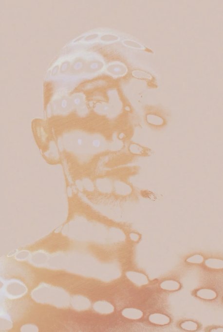 An artistic sepia-toned portrait of a person with short hair, featuring an overlay of oval-shaped light patterns across the face and body.